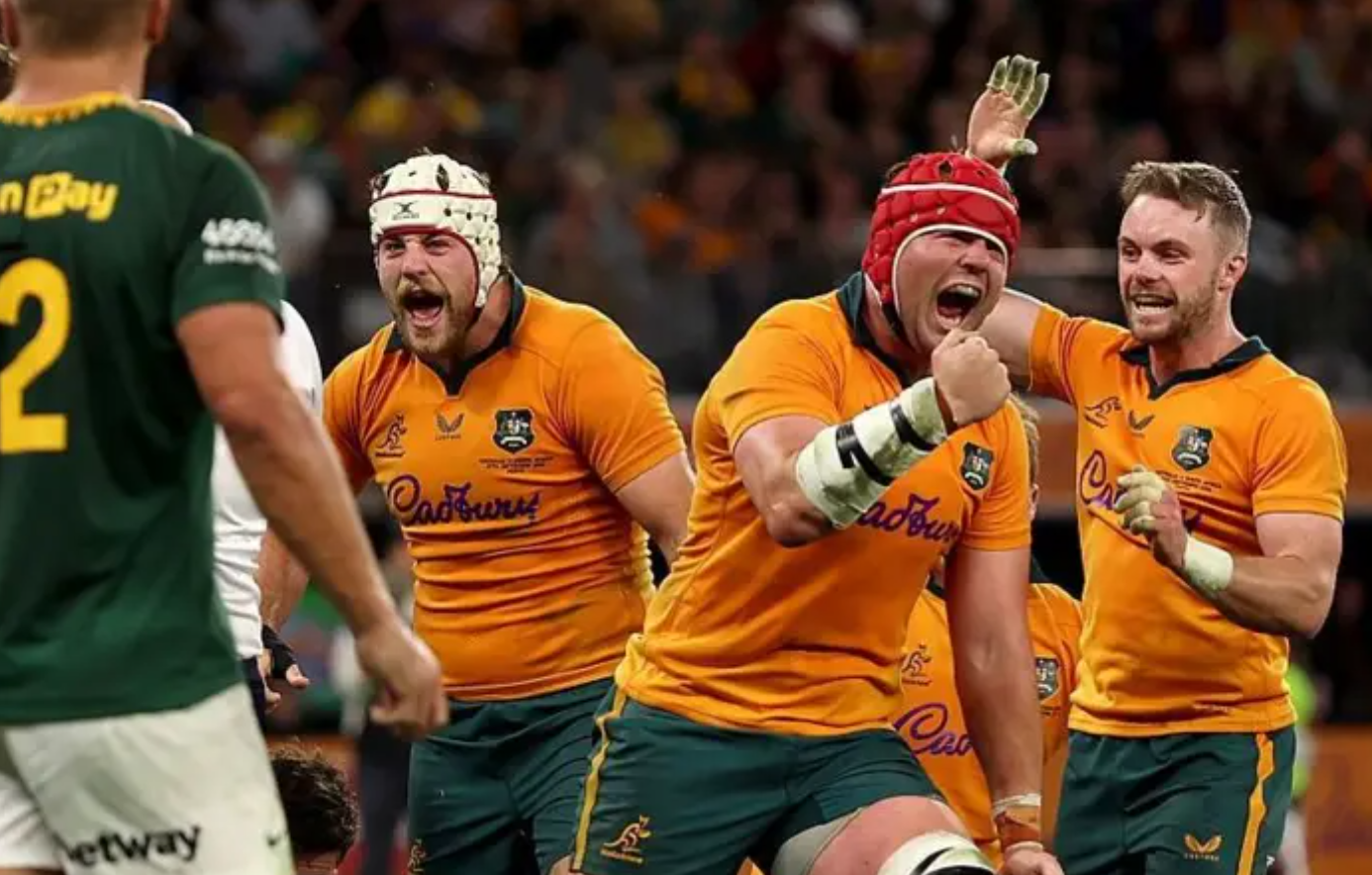 Wallabies captain Harry Wilson celebrates the try he scored.